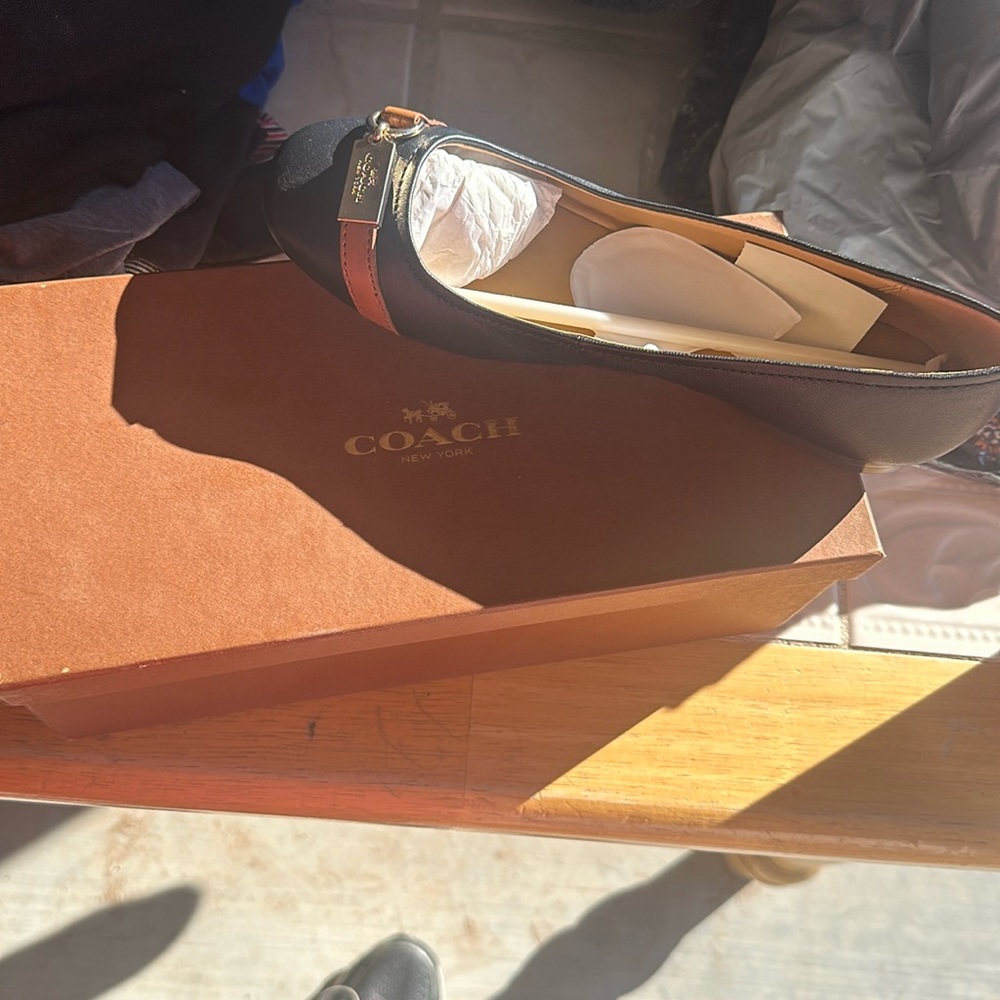 Coach slip ons